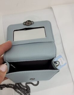 Alternative view of CARTERA MINI DE CUERO CELESTE CON CORREA LARGA METALICA